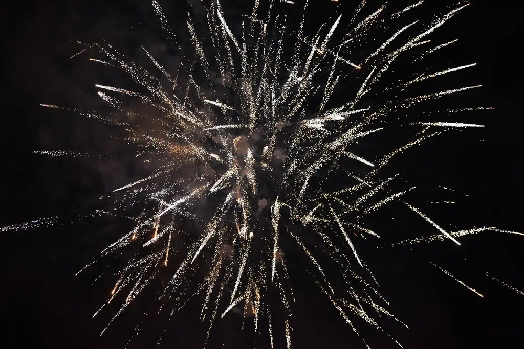 Bursting fireworks illuminate the night sky in Ontario, Canada