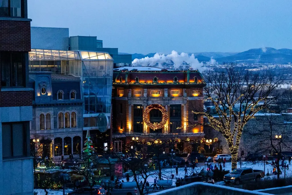 Magical winter evening in Quebec City's Old Town lit with festive lights and decorations