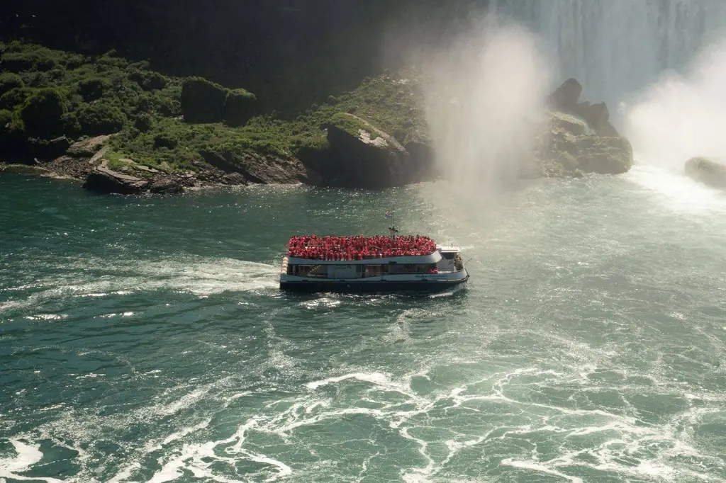 A tourist boat approaches Niagara Falls