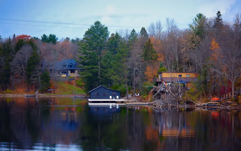 Autumn colours reflected in a lake in Huntsville, Muskoka