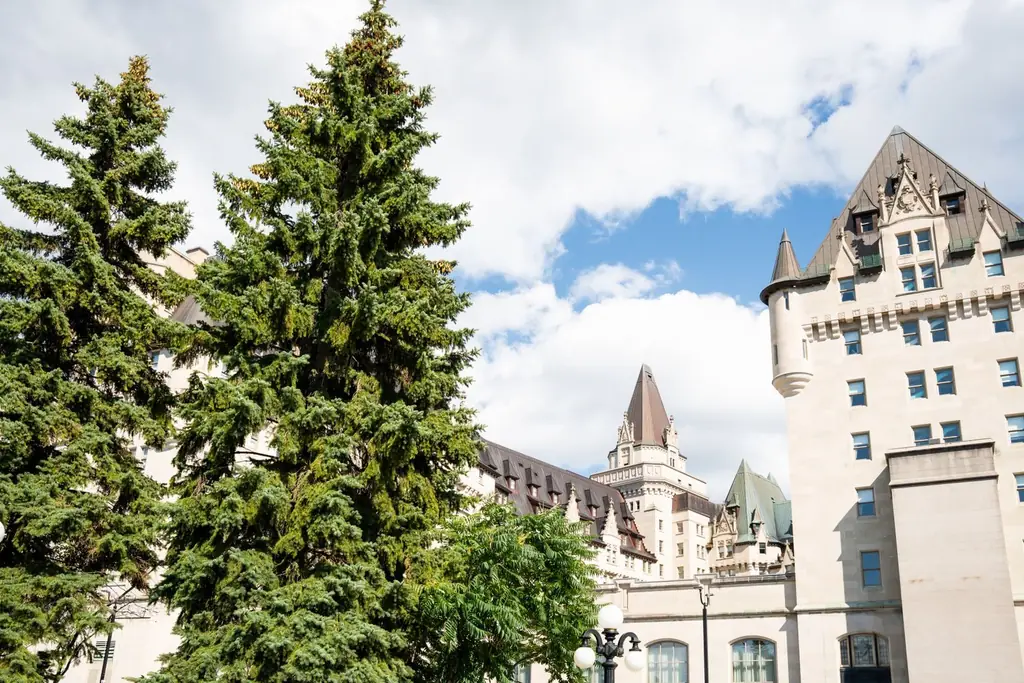 Summer day at the historic Chateau Laurier in Ottawa, surrounded by greenery