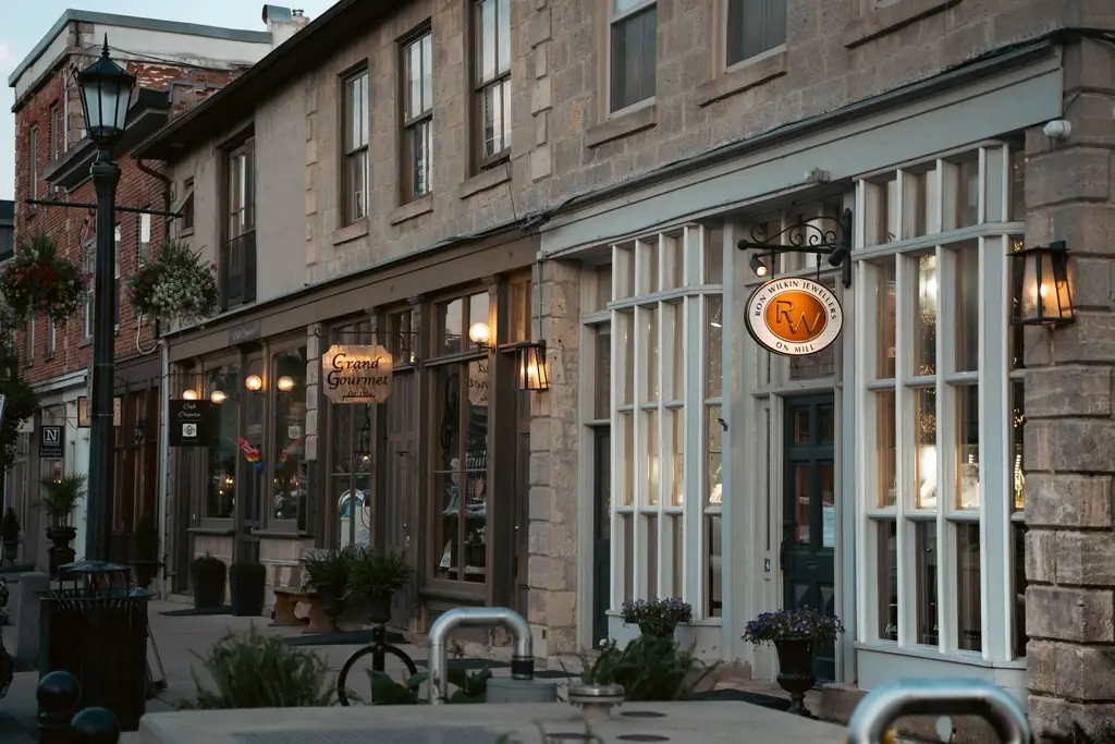 Boutique shops in historic stone buildings on an Ontario main street