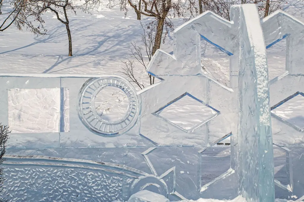 Intricate ice sculpture in a snowy winter park