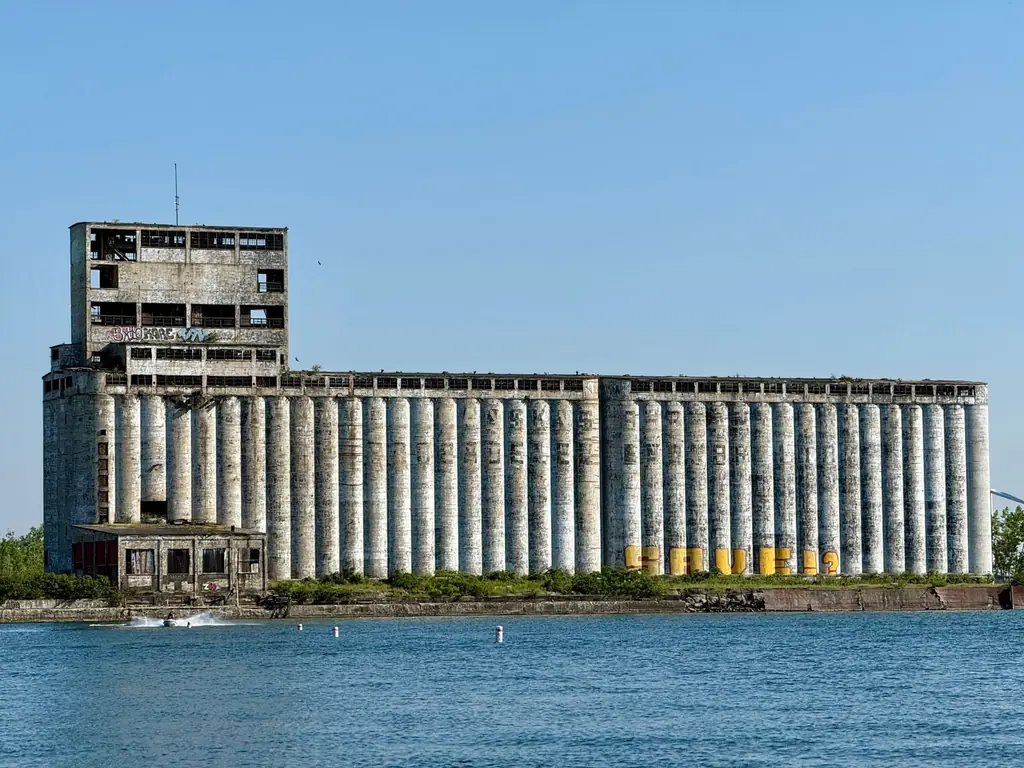 Old grain silo structures along Buffalo's waterfront on a clear summer day