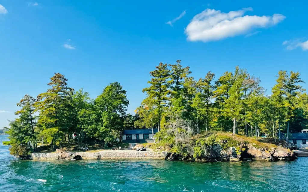 Island view in Leeds and the Thousand Islands, Canada with lush greenery and clear waters