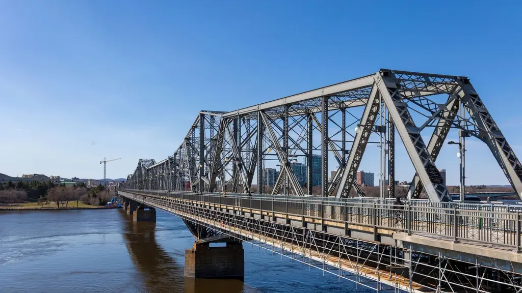 View of the historic Alexandra Bridge in Ottawa over the tranquil Ottawa River