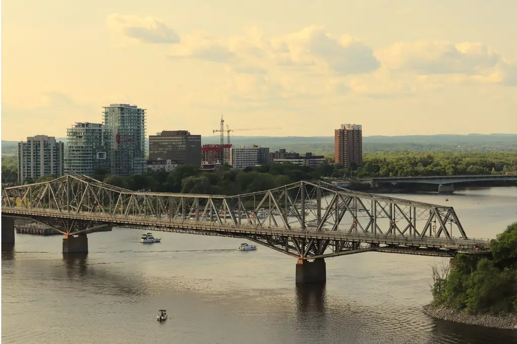 Aerial view of Alexandra Bridge spanning the Ottawa River, with Gatineau skyline in the background