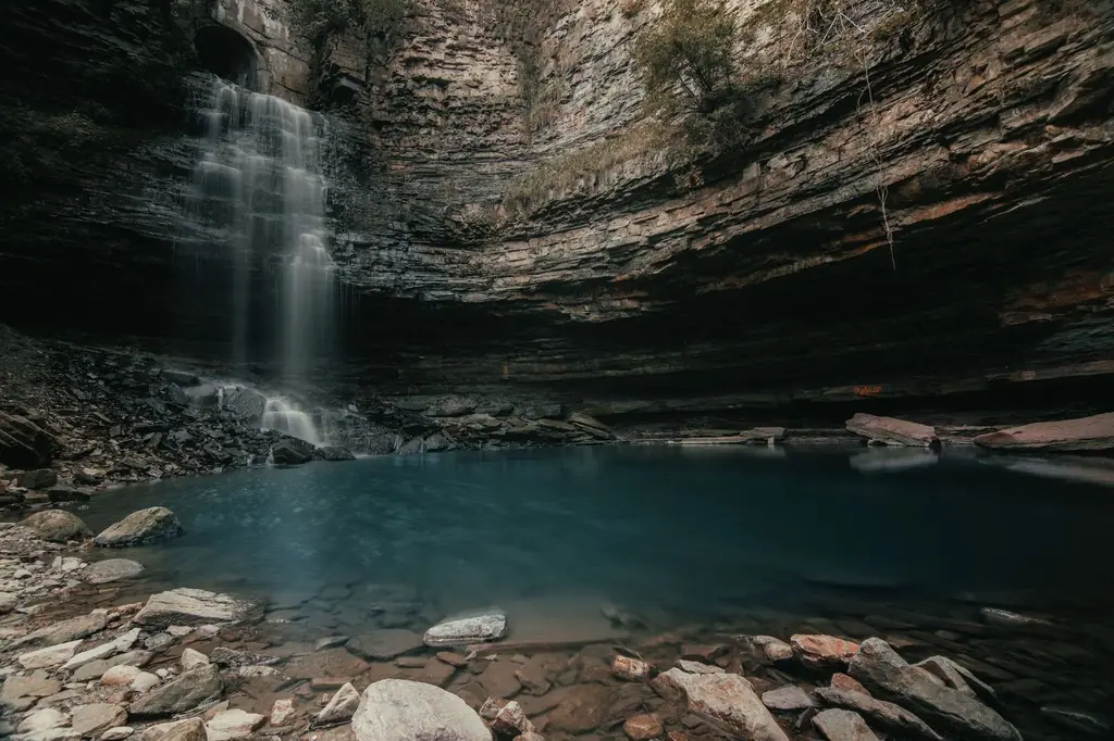 Waterfall cascading into a tranquil grotto in Hamilton, Ontario
