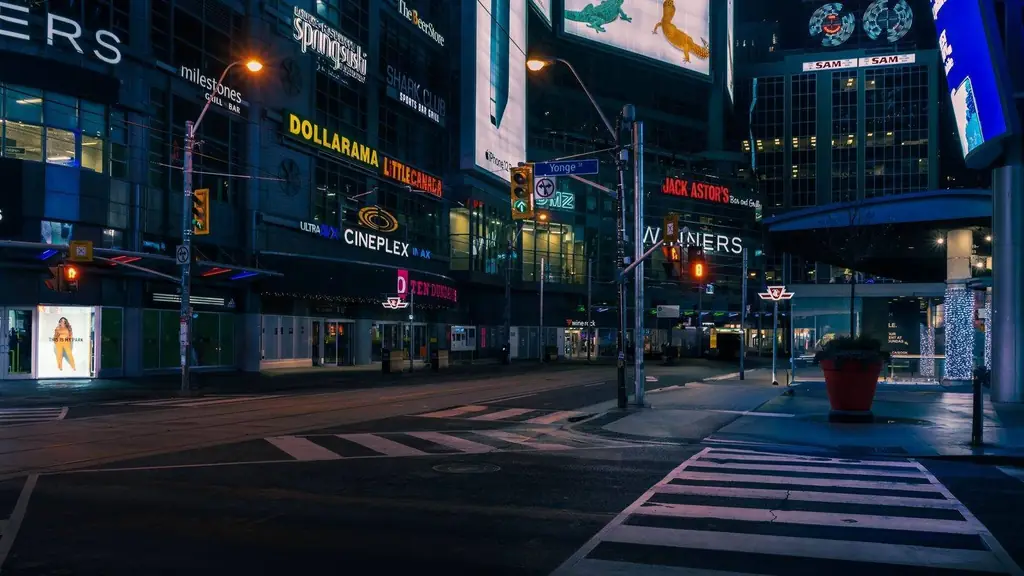 A bustling evening scene at Yonge and Dundas Square, Toronto with illuminated signs