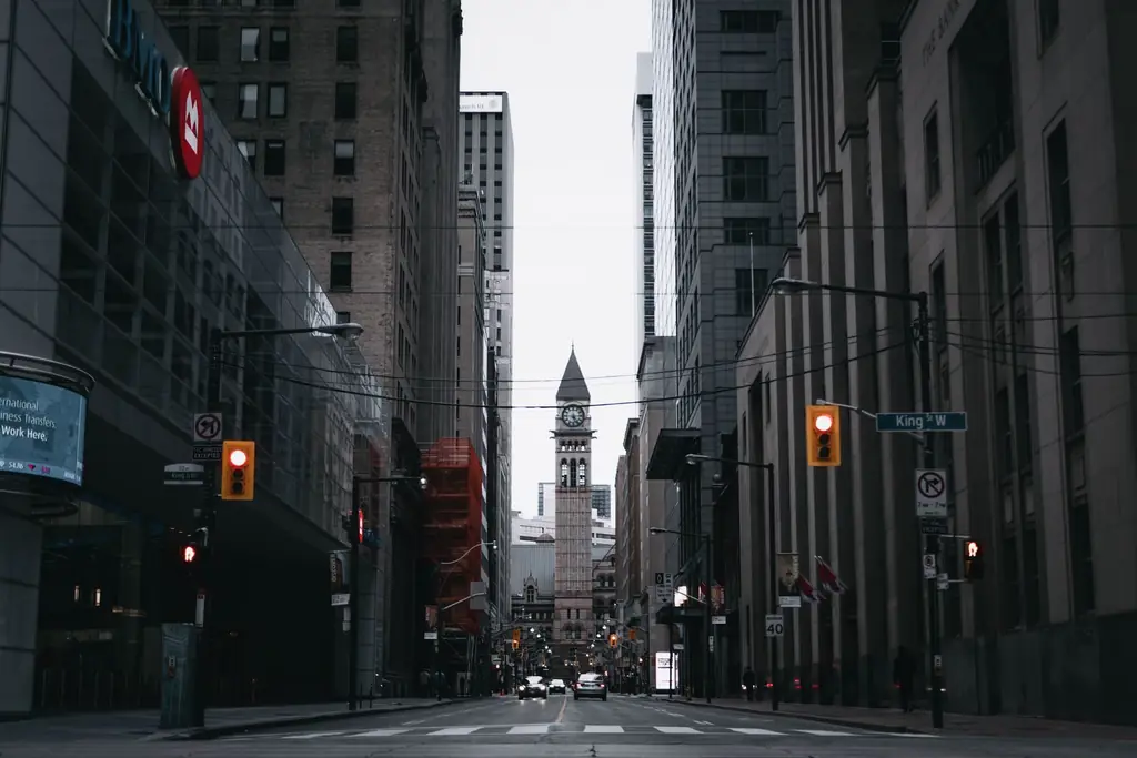 Toronto's urban street with the historic Old City Hall clock tower