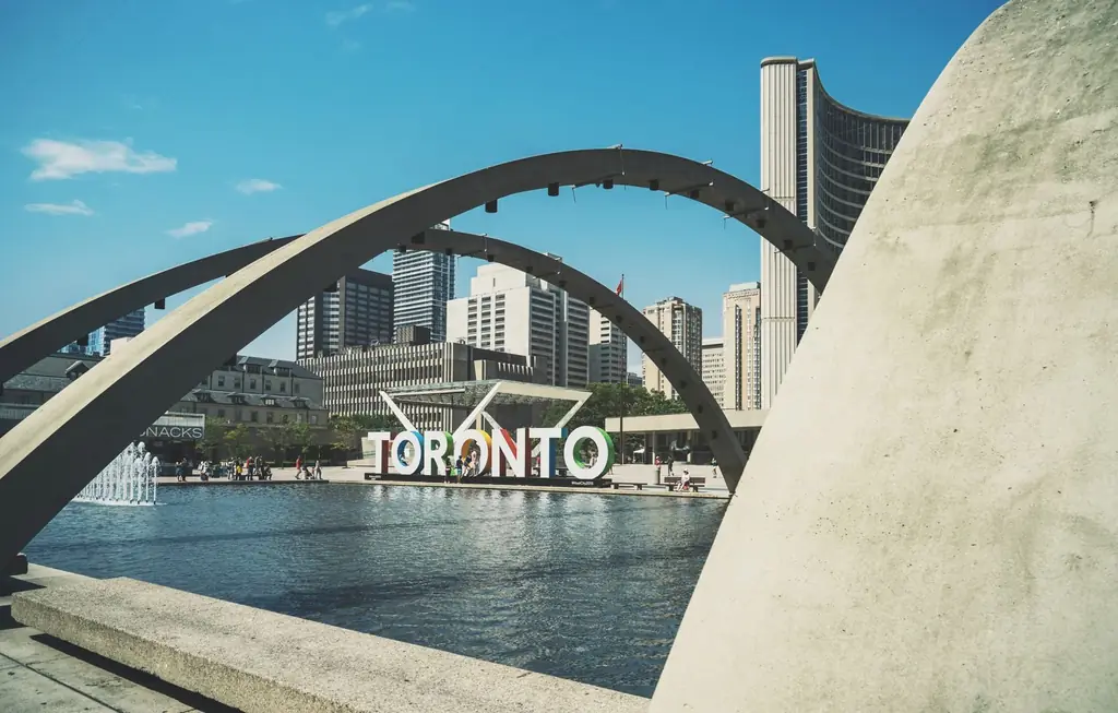 Modern architecture and skyline at Nathan Phillips Square, Toronto with iconic sign