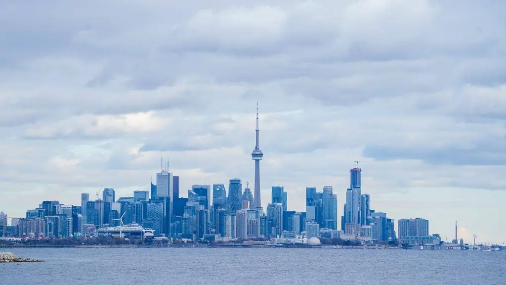 Toronto skyline featuring the iconic CN Tower under a cloudy sky