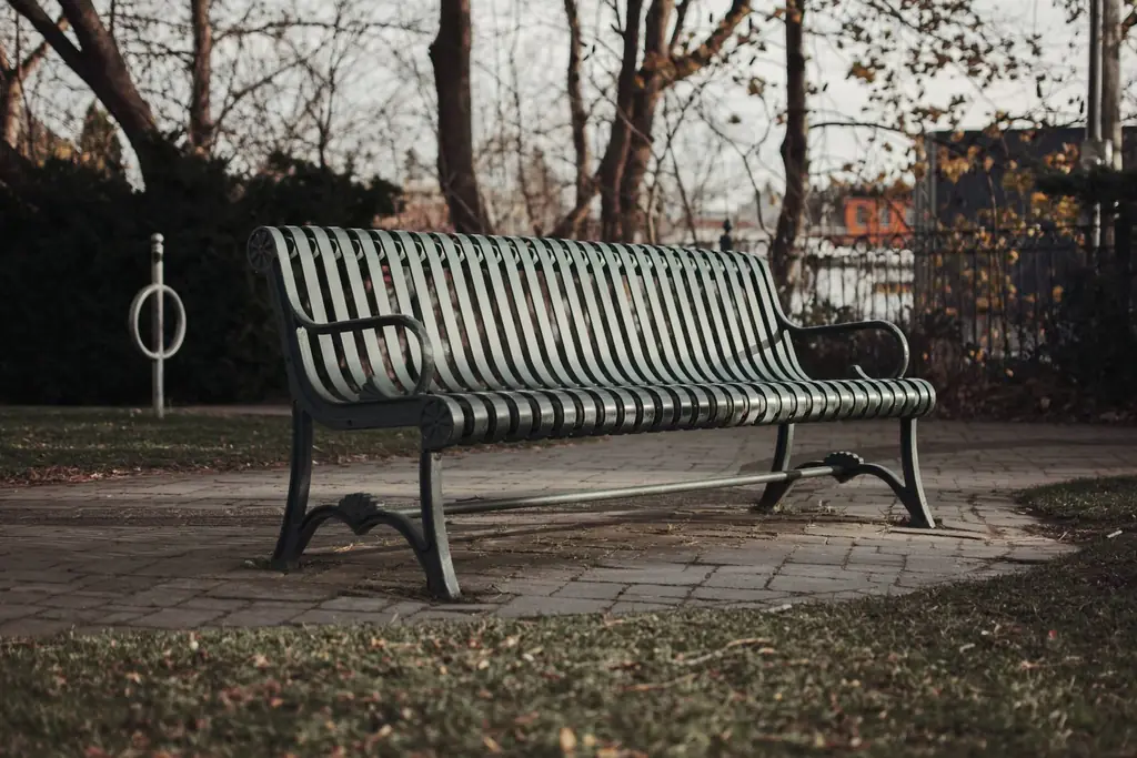 Autumn scene with a solitary park bench in Milton, Ontario