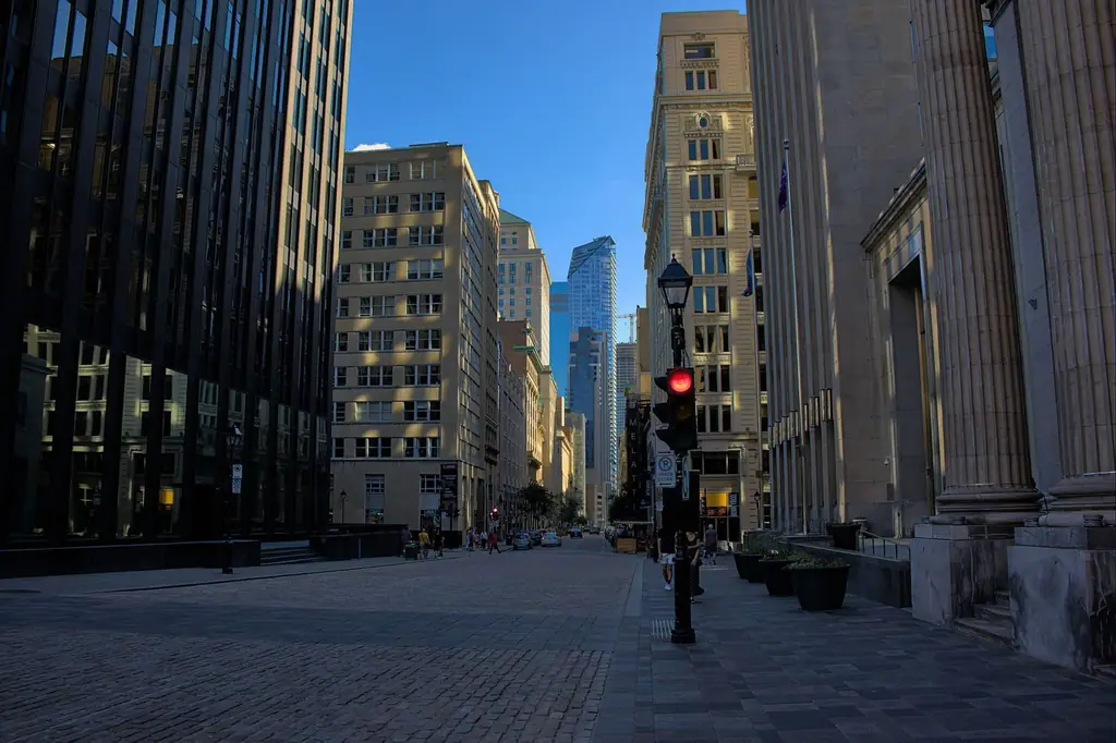 Dynamic cityscape of Montreal with towering skyscrapers and vibrant street life