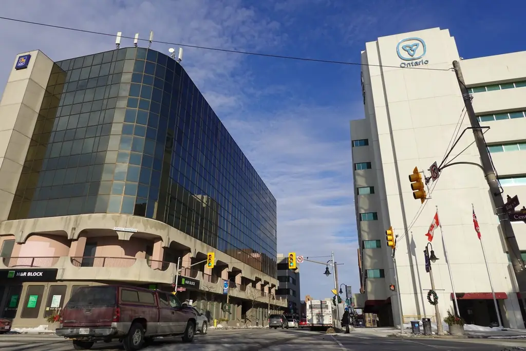 Low angle view of modern office buildings and traffic in downtown Oshawa, Ontario, Canada