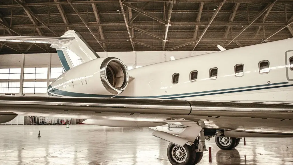 Business jet with its engine nacelle visible inside a hangar