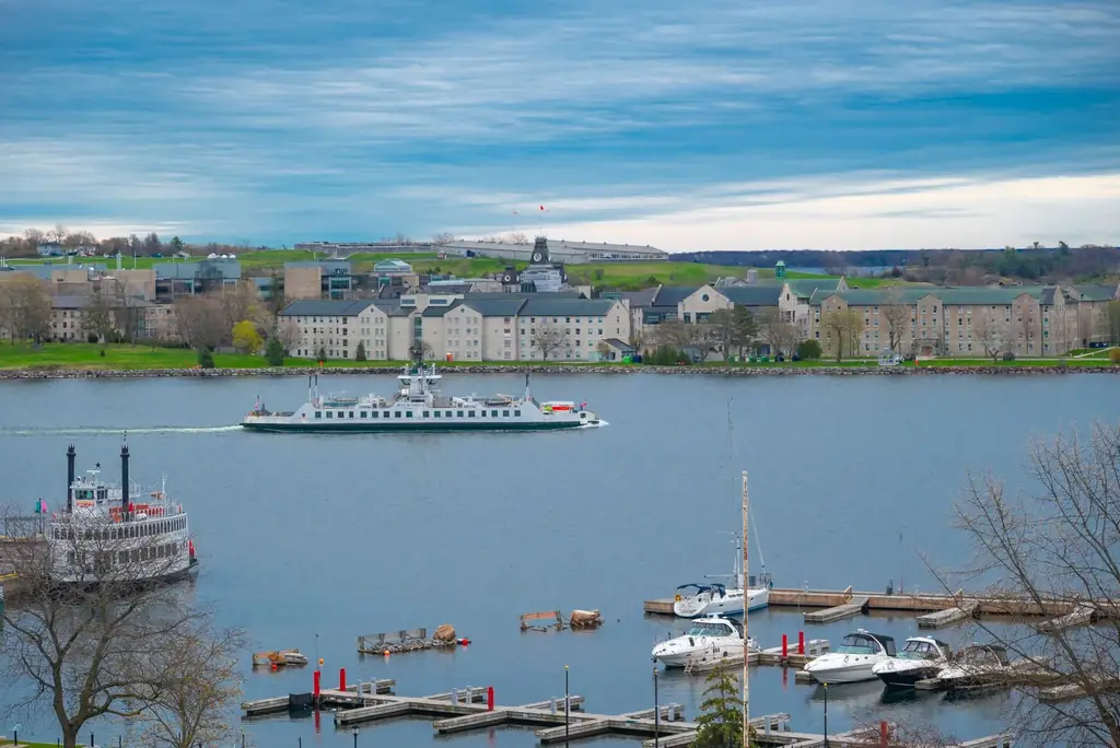 View of Kingston's waterfront with boats and historic architecture on a clear day