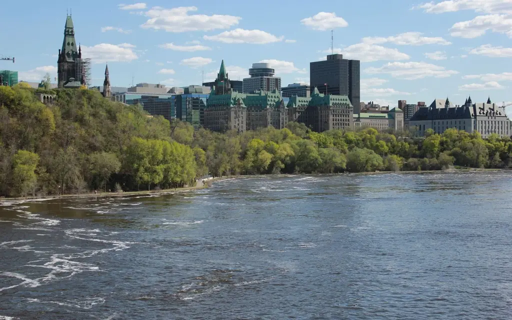 View of Ottawa's Parliament buildings and the Ottawa River on a clear day
