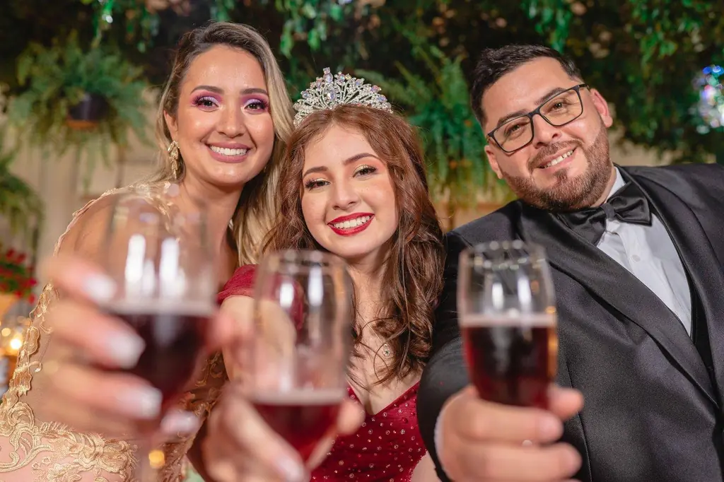 Group of elegantly dressed friends toasting with champagne glasses at a festive celebration