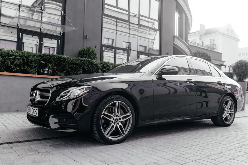 Black Mercedes car parked on city street