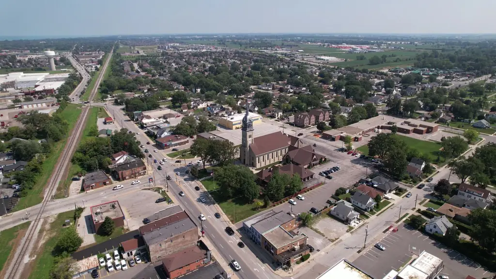 Aerial cityscape of Windsor, Ontario, showing buildings, roads, and green spaces